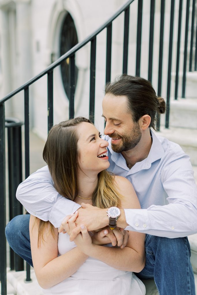 Couple on staircase from Charleston, South Carolina engagement session. Rachel Fugate Photography