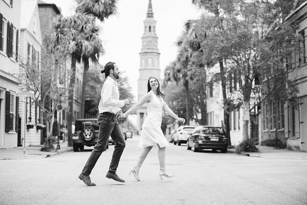 Couple crossing street from Charleston, South Carolina engagement session. Rachel Fugate Photography