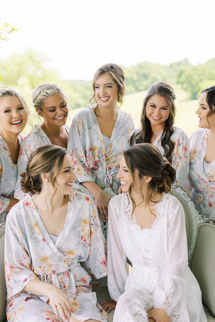 Bride and bridesmaids with matching floral robes. Rachel Fugate Photography