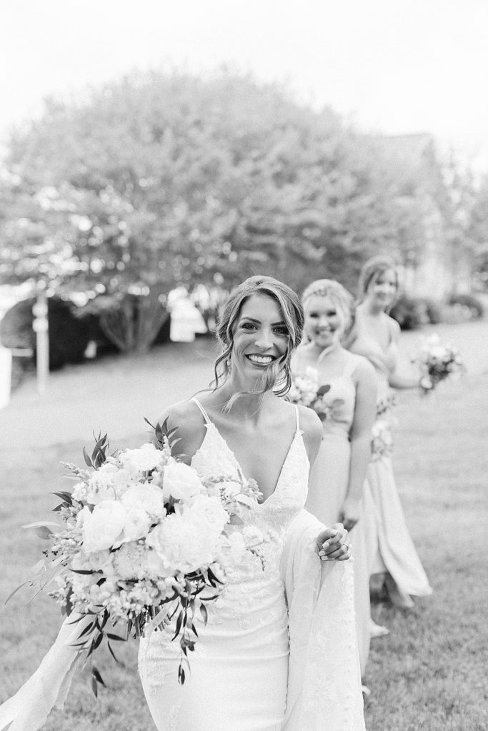 Bride and bridesmaids walking to ceremony at Mint Springs Farm - Rachel Fugate Photography
