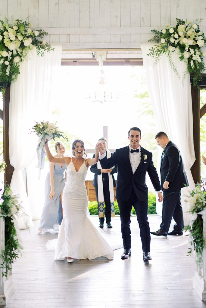 Bride and groom excited cheers after ceremony - Rachel Fugate Photography
