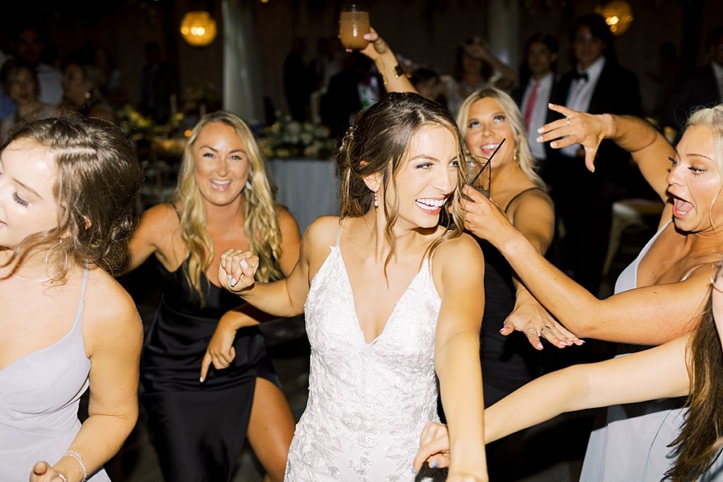Bride and bridesmaids dancing at wedding - Rachel Fugate Photography
