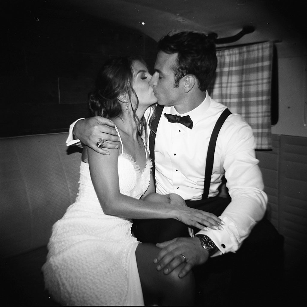 Bride and groom kiss in VW bus photo booth at Tennessee wedding - Rachel Fugate Photography